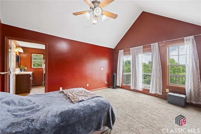 bedroom with carpet flooring, connected bathroom, high vaulted ceiling, and ceiling fan