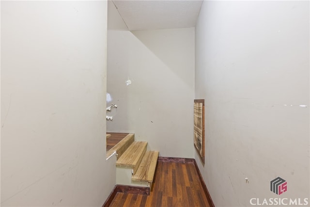 hallway with wood-type flooring