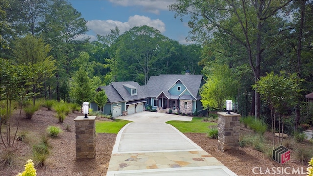 view of front of house featuring a garage and a front lawn