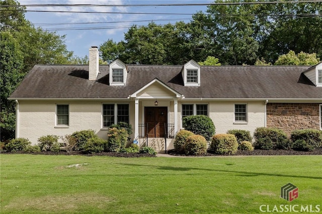 cape cod-style house featuring a front lawn