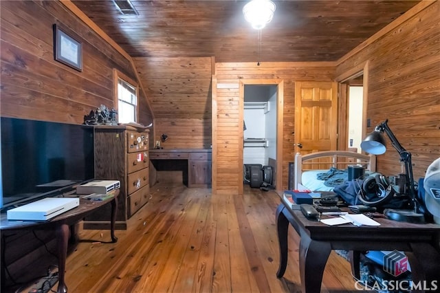 office featuring hardwood / wood-style floors, wooden walls, lofted ceiling, and wood ceiling