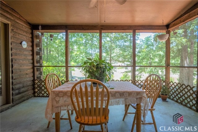 sunroom / solarium featuring wood ceiling