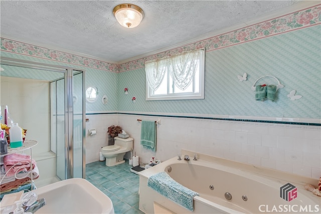 bathroom featuring a textured ceiling, tile floors, tile walls, sink, and toilet