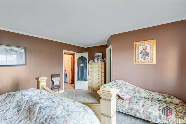 carpeted bedroom featuring crown molding