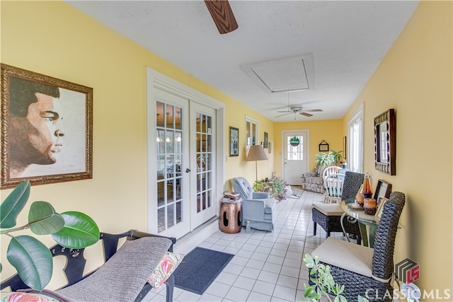 sunroom with french doors and ceiling fan