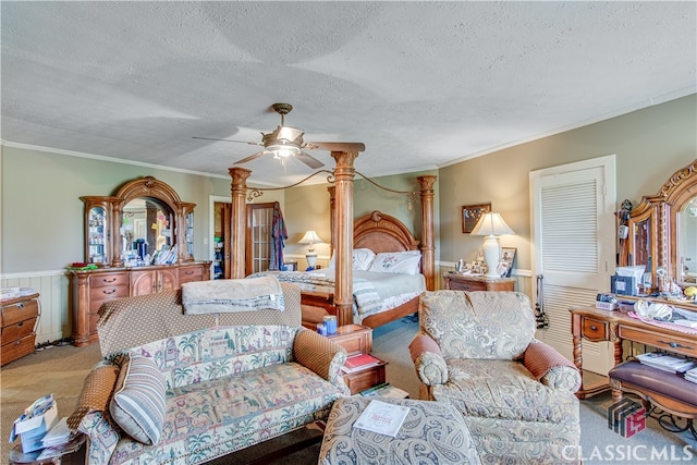 bedroom featuring a textured ceiling, carpet, and ceiling fan