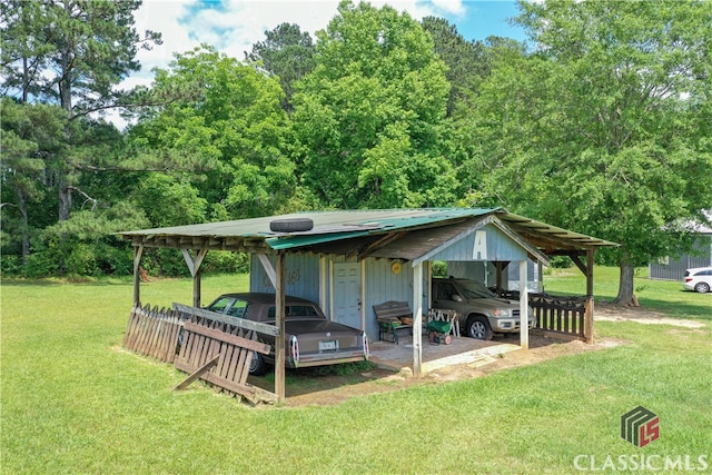 exterior space with a carport and a yard