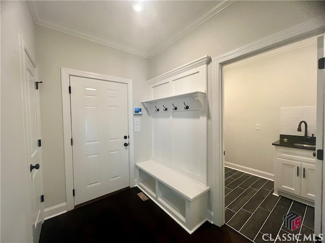 mudroom featuring dark hardwood / wood-style flooring and ornamental molding