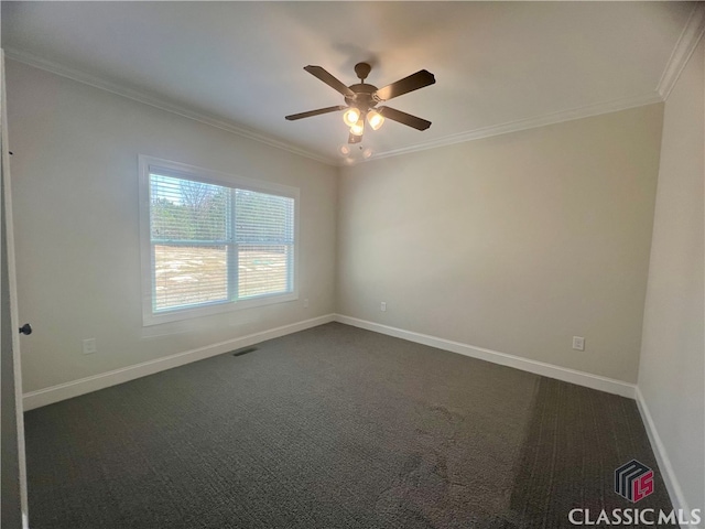 spare room with ceiling fan, crown molding, and carpet flooring