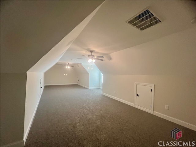 additional living space featuring ceiling fan, carpet floors, and lofted ceiling