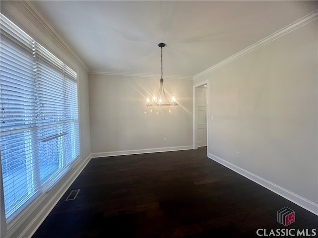 unfurnished dining area featuring a wealth of natural light, a chandelier, dark hardwood / wood-style floors, and crown molding