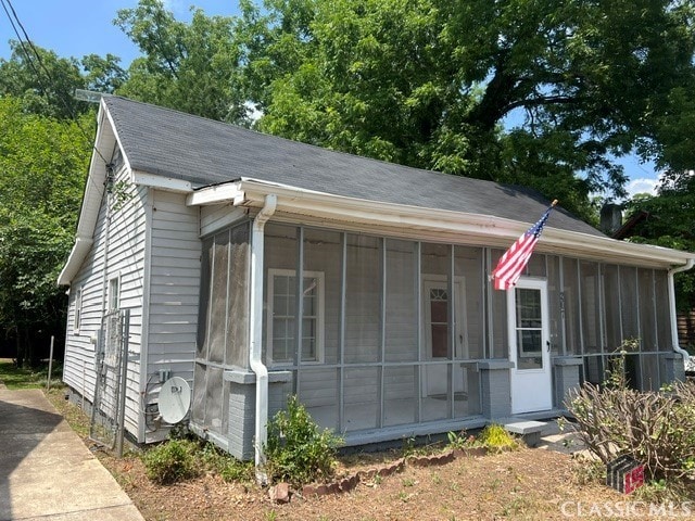 view of front of property with a sunroom