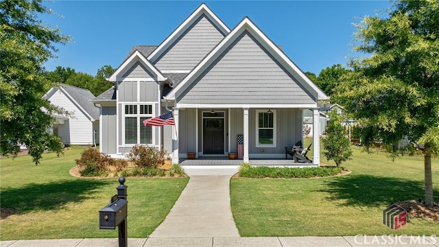 view of front facade with covered porch and a front yard