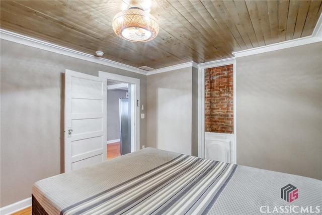 bedroom featuring ornamental molding and wood ceiling