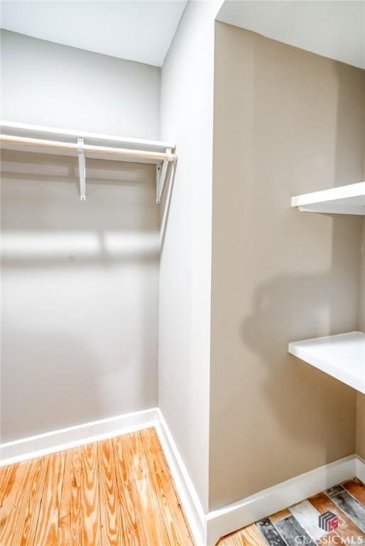 walk in closet featuring hardwood / wood-style floors