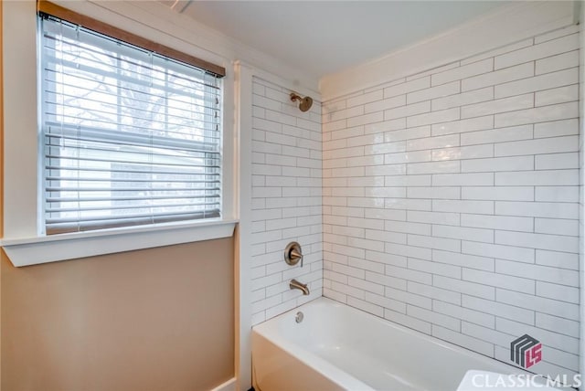 bathroom featuring tiled shower / bath combo and a wealth of natural light