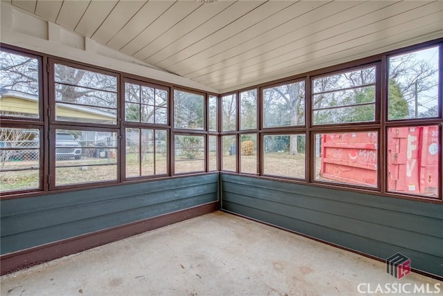 unfurnished sunroom with vaulted ceiling