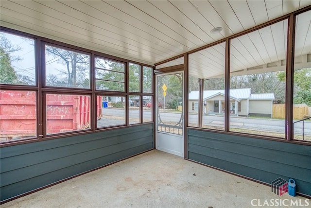 unfurnished sunroom featuring wood ceiling