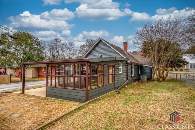 rear view of house with a yard