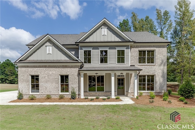 craftsman-style home featuring a front yard and a porch