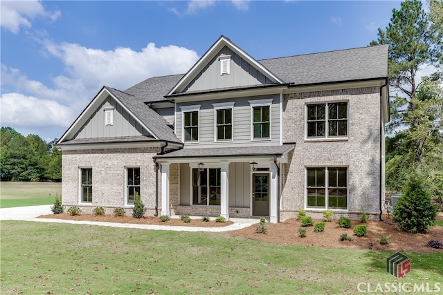 craftsman-style house with a porch and a front lawn