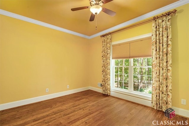 spare room featuring hardwood / wood-style flooring, crown molding, and ceiling fan