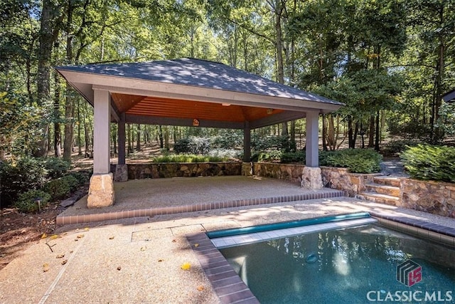 view of swimming pool with a gazebo