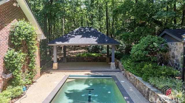 view of pool with a gazebo and a patio