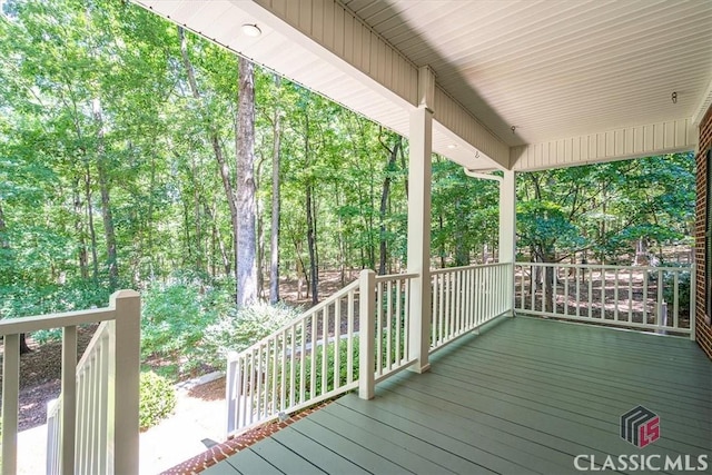 wooden deck featuring covered porch