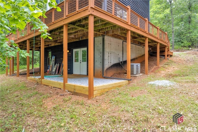 exterior space featuring a wooden deck and central air condition unit