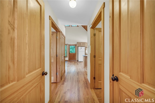 corridor with light wood-style floors
