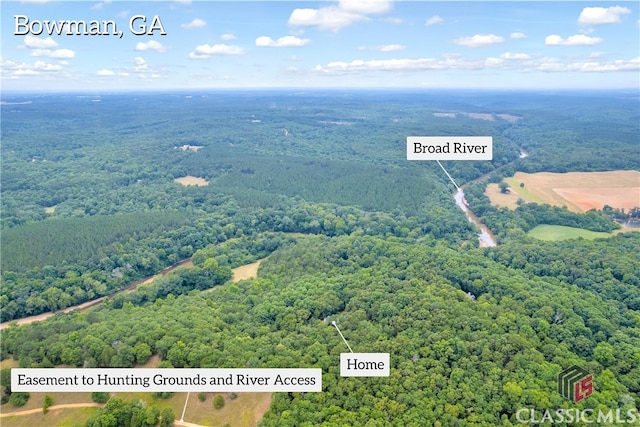 aerial view with a wooded view