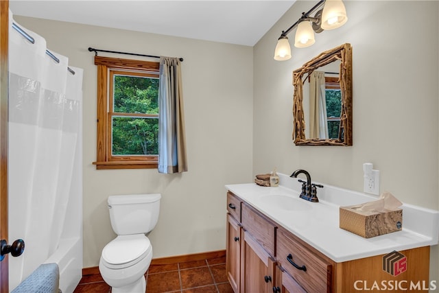 bathroom with tile patterned floors, vanity, toilet, and baseboards