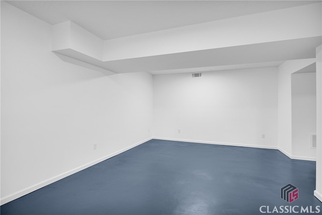 finished below grade area with baseboards and visible vents
