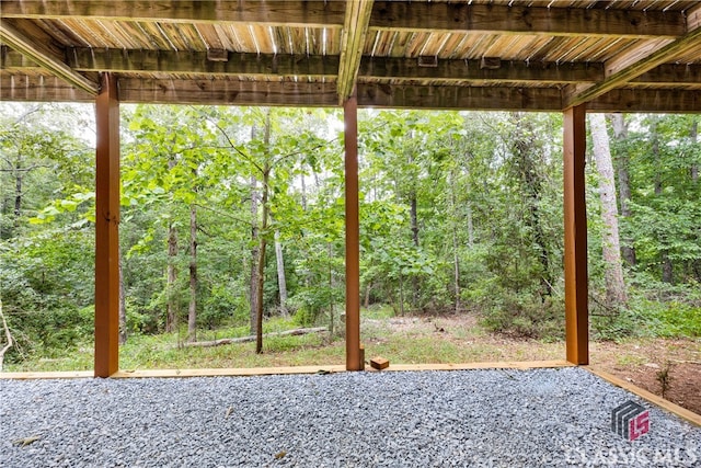 view of patio featuring a forest view