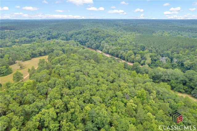 bird's eye view featuring a forest view