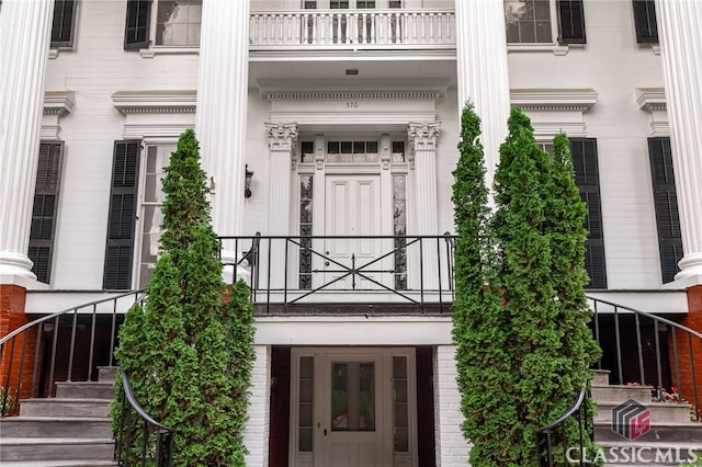 doorway to property featuring a balcony