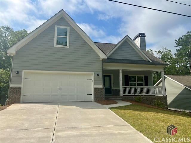 view of front of home with covered porch and a front yard