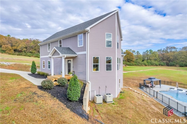 view of front of home featuring a deck and a front lawn