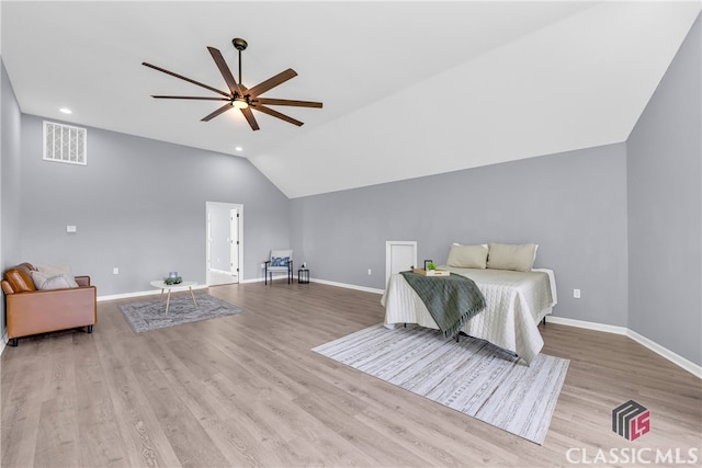 bedroom with ceiling fan, light wood-type flooring, and lofted ceiling