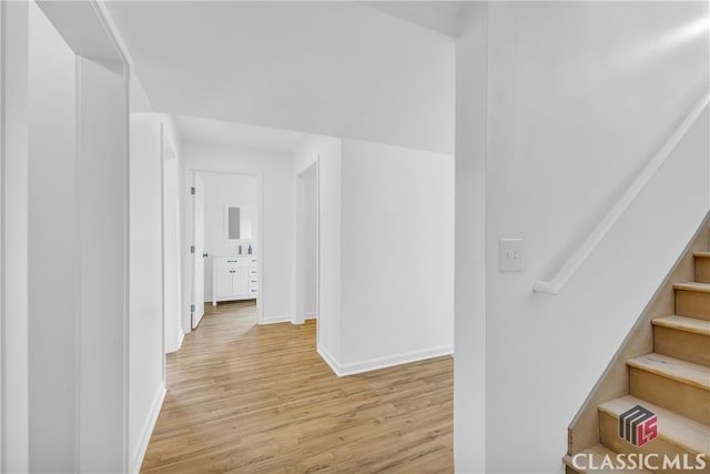 hallway with light wood-type flooring