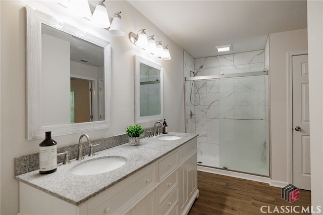 bathroom with vanity, hardwood / wood-style floors, and an enclosed shower