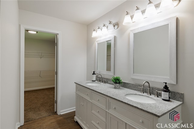 bathroom featuring hardwood / wood-style flooring and vanity