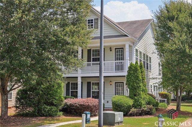 view of front of house with a balcony