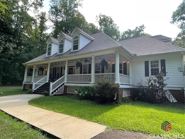 view of front facade with covered porch and a front yard