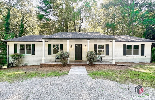 single story home with covered porch