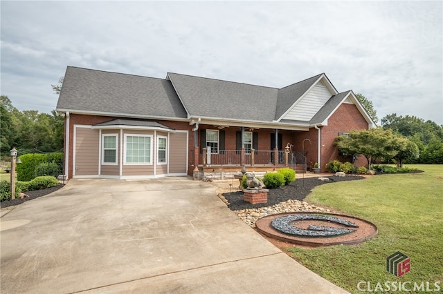 view of front facade with a front yard and a porch