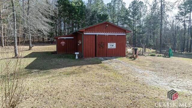 view of outbuilding with a lawn