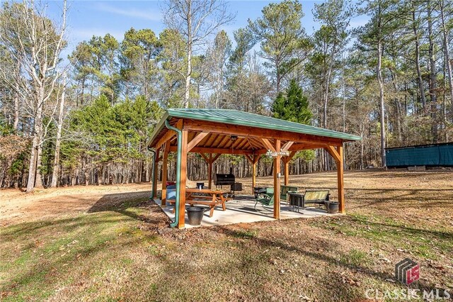 exterior space with a lawn and a gazebo