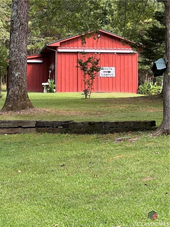 view of outdoor structure with a lawn